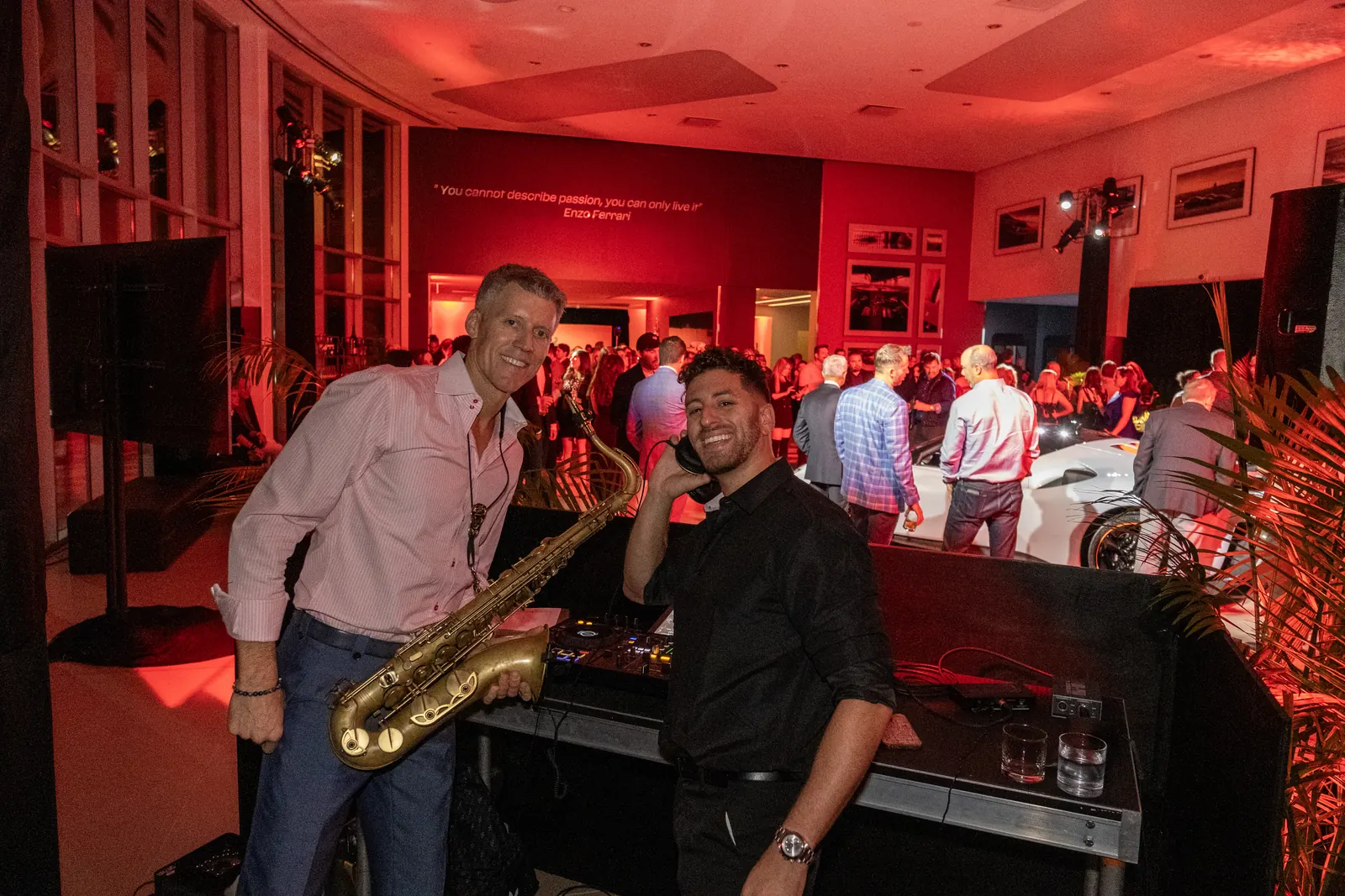 DJ Jordan Miller performing with a live saxophonist at the Ferrari SF90 XX Stradale reveal, Ferrari of Austin, October 2023