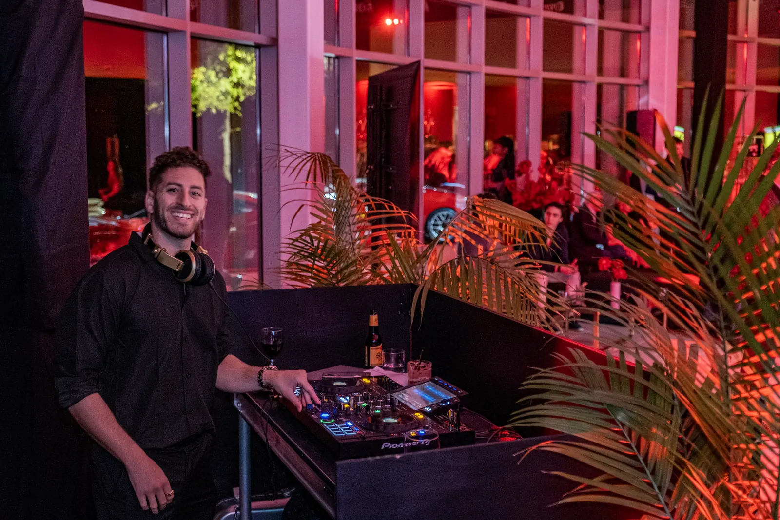 DJ Jordan Miller at the booth during the Ferrari SF90 XX Stradale reveal in Austin