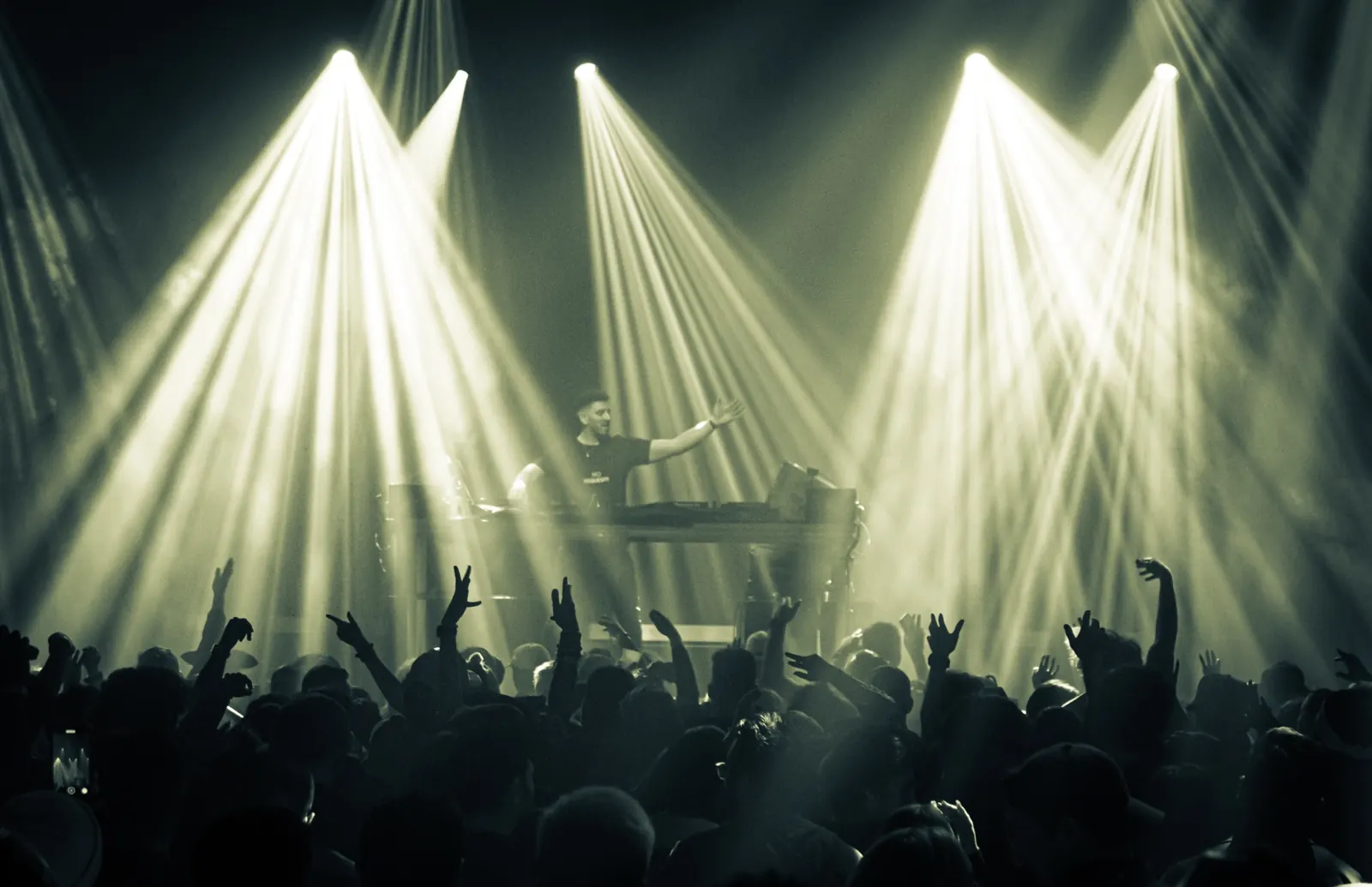 Stage beams and LED wall over the crowd during a Jordan Miller headline set