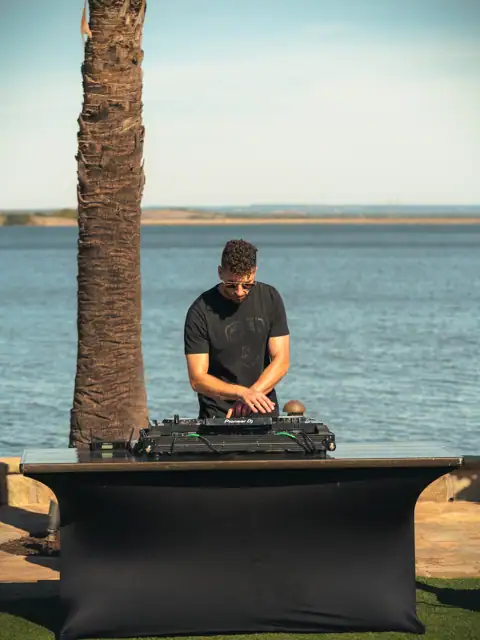 Jordan Miller DJing a Lamborghini Austin event on Lake Austin, 2024, photo 1