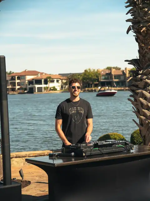 Jordan Miller DJing a Lamborghini Austin event on Lake Austin, 2024, photo 7