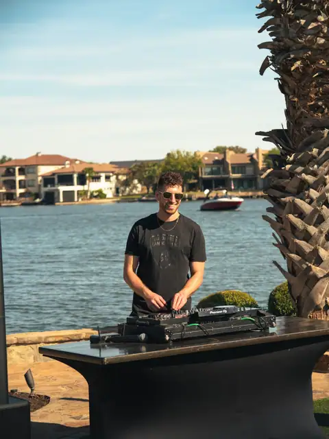 Jordan Miller DJing a Lamborghini Austin event on Lake Austin, 2024, photo 8