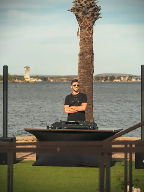 Jordan Miller DJing a Lamborghini Austin event on Lake Austin, 2024, photo 10