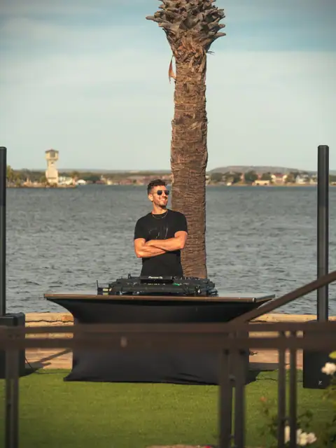 Jordan Miller DJing a Lamborghini Austin event on Lake Austin, 2024, photo 11