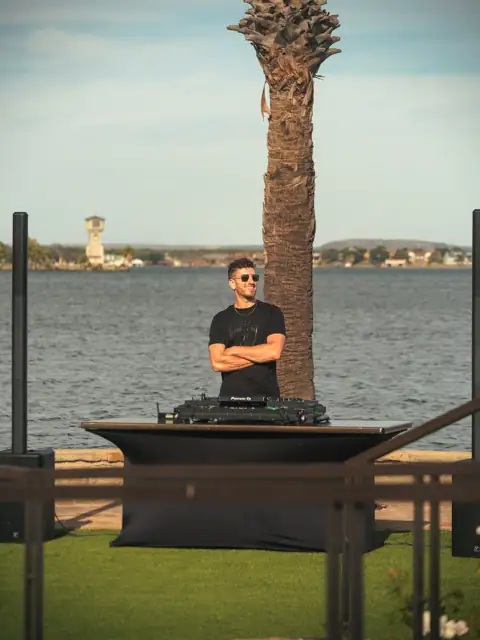 Jordan Miller DJing a Lamborghini Austin event on Lake Austin, 2024, photo 12