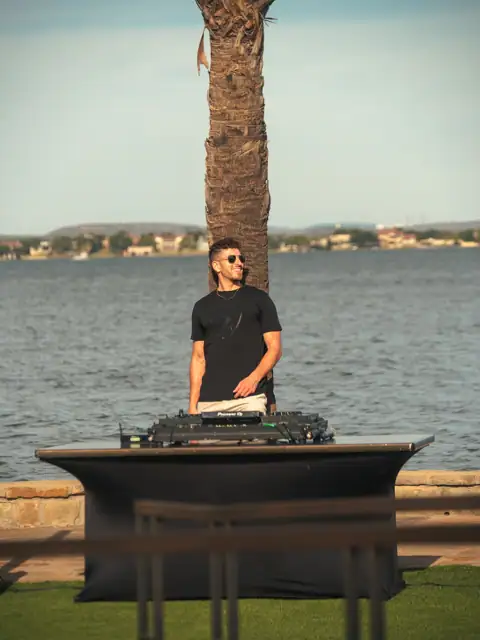 Jordan Miller DJing a Lamborghini Austin event on Lake Austin, 2024, photo 14