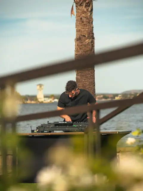 Jordan Miller DJing a Lamborghini Austin event on Lake Austin, 2024, photo 15