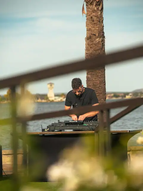 Jordan Miller DJing a Lamborghini Austin event on Lake Austin, 2024, photo 16