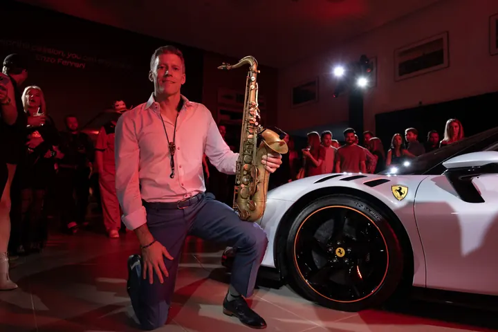 Ferrari F1 Reception 2023, SF90 unveiling, with Jordan Miller: Sax Posing with Ferrari (photo 9 of 13)