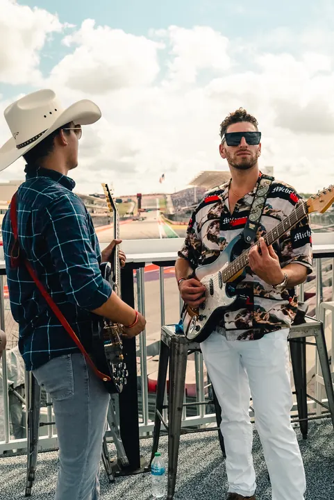 Jordan Miller with guitar at the US Grand Prix, Circuit of the Americas, 2023 (photo 1 of 16)