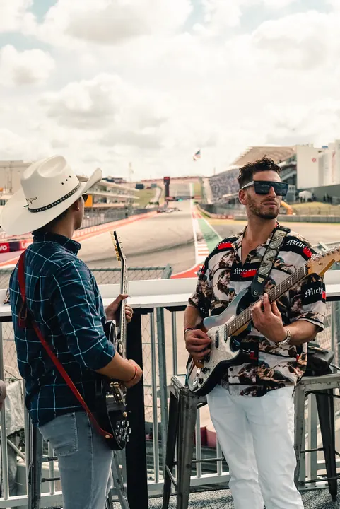 Jordan Miller with guitar at the US Grand Prix, Circuit of the Americas, 2023 (photo 2 of 16)