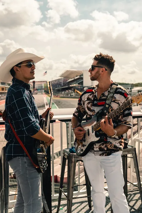 Jordan Miller with guitar at the US Grand Prix, Circuit of the Americas, 2023 (photo 3 of 16)